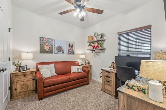 carpeted office featuring ceiling fan