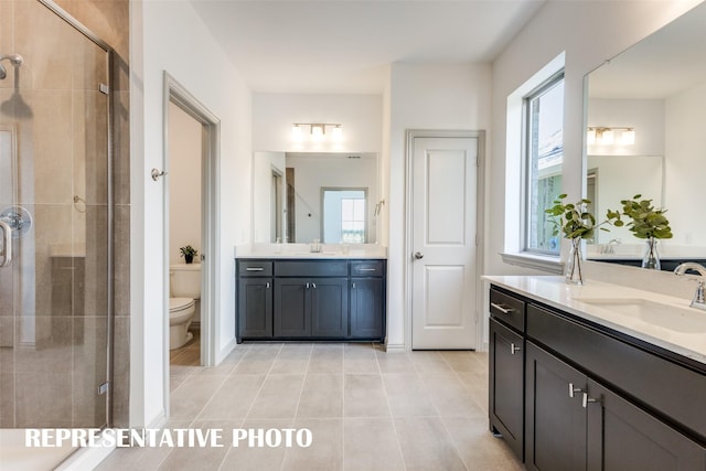 bathroom with a wealth of natural light, tile patterned floors, toilet, and walk in shower