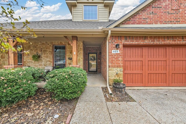 doorway to property featuring a garage