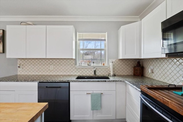 kitchen featuring white cabinetry, wood counters, dishwasher, and sink