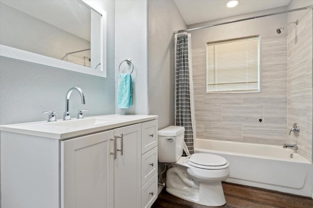 full bathroom with vanity, toilet, shower / tub combo, and wood-type flooring