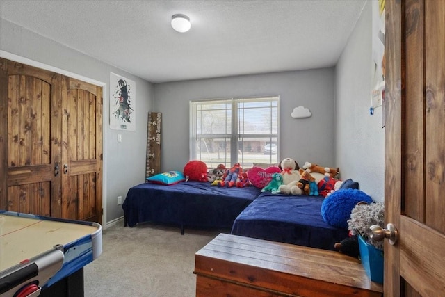 carpeted bedroom with a textured ceiling