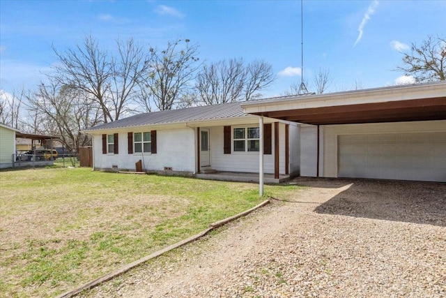 single story home featuring a front lawn, a garage, and a carport