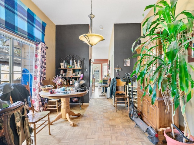 dining area featuring light parquet flooring