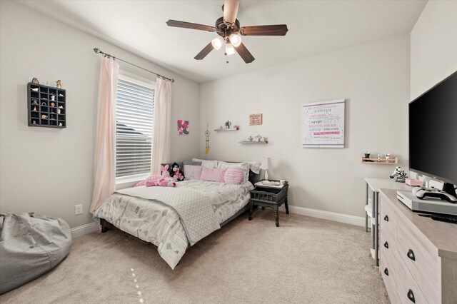 bedroom featuring ceiling fan and light carpet