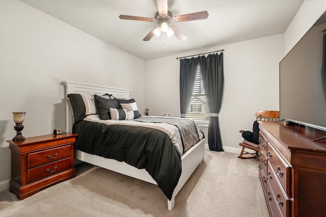 bedroom featuring ceiling fan and light colored carpet