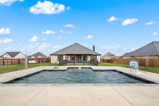 view of swimming pool featuring a patio, pool water feature, and a lawn