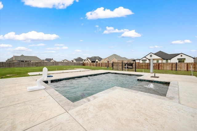 view of swimming pool featuring pool water feature, a yard, and a patio