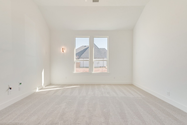 unfurnished room with light colored carpet