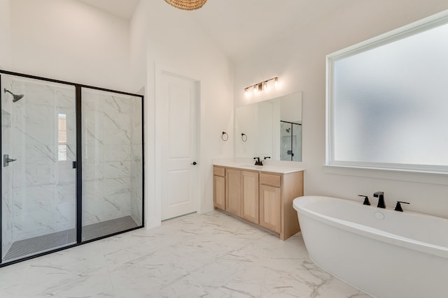 912 Shady Oaks Dr, Rockwall, TX 75087 - bathroom with marble look tile flooring, a marble finish shower, a soaking tub, vanity, and lofted ceiling