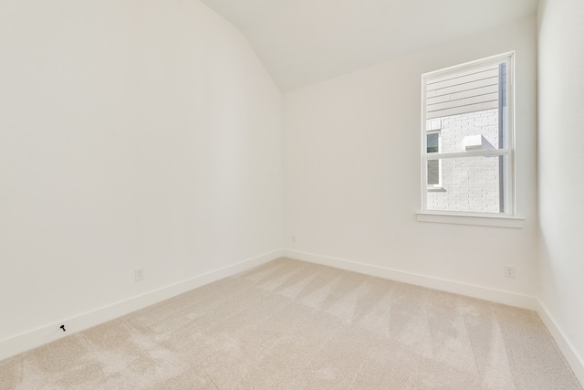 912 Shady Oaks Dr, Rockwall, TX 75087 - spare room with light colored carpet and vaulted ceiling