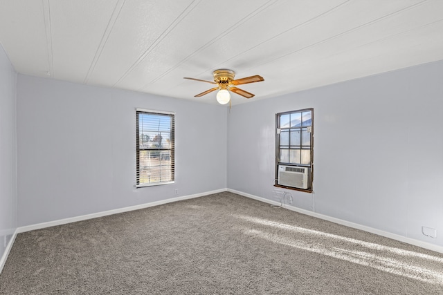 carpeted spare room featuring ceiling fan and cooling unit