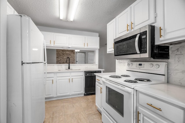 kitchen featuring backsplash, white cabinetry, sink, and white appliances