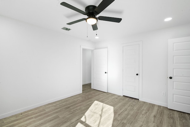 unfurnished bedroom featuring light wood-type flooring and ceiling fan