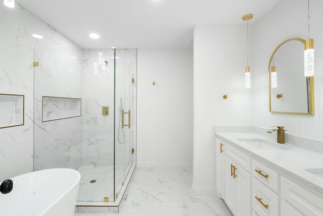 bathroom featuring vanity and shower with separate bathtub