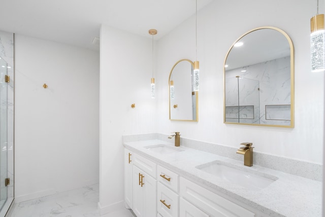 bathroom with vanity and a shower with shower door