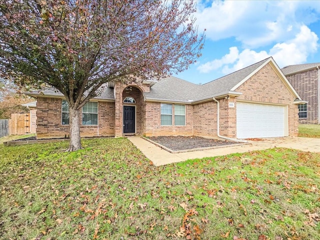 ranch-style house with a garage and a front lawn