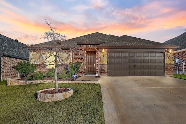 prairie-style house with a yard and a garage