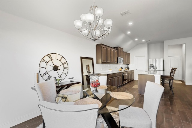 dining space with dark hardwood / wood-style flooring, vaulted ceiling, and a notable chandelier