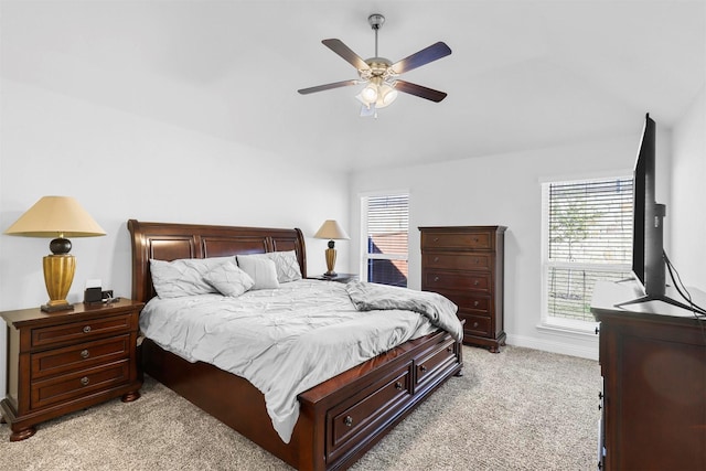 bedroom with ceiling fan and light carpet