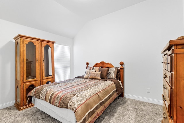 carpeted bedroom featuring vaulted ceiling