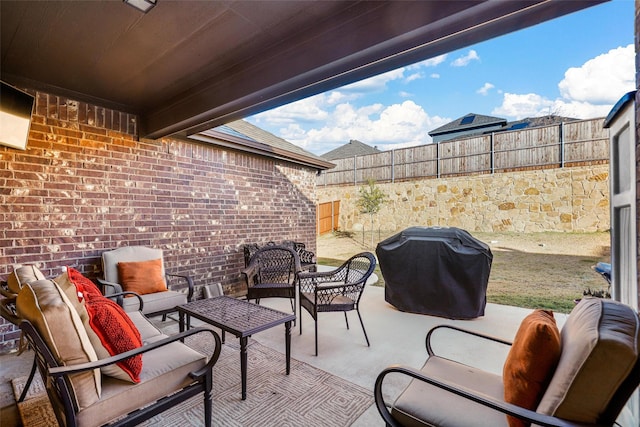 view of patio / terrace featuring a grill and an outdoor hangout area