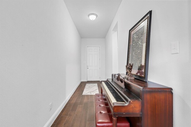 miscellaneous room featuring dark hardwood / wood-style floors