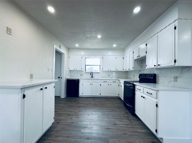 kitchen with black appliances, tasteful backsplash, white cabinets, and dark wood-type flooring