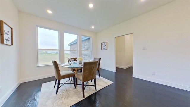 dining area featuring dark hardwood / wood-style floors