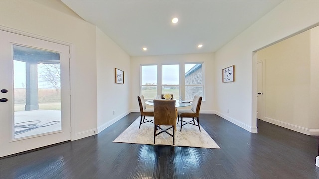 dining space with dark hardwood / wood-style floors and plenty of natural light