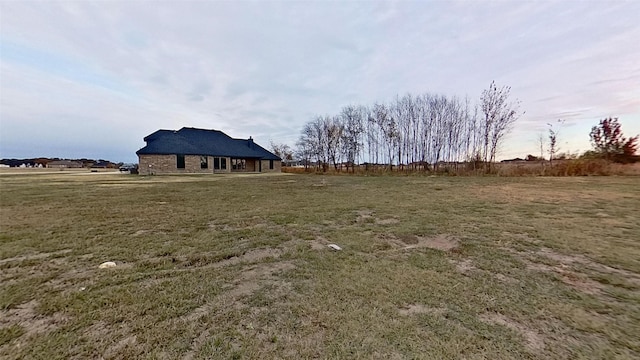 view of yard with a rural view