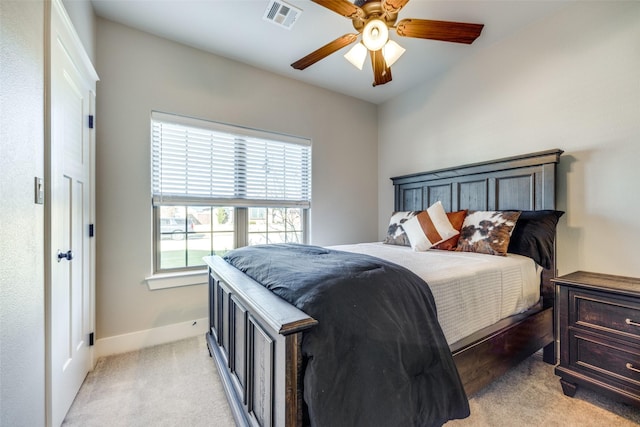 bedroom featuring ceiling fan and light colored carpet