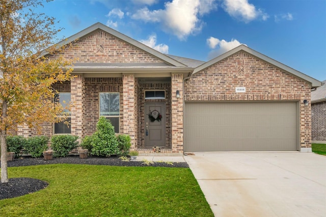 view of front facade with a front yard and a garage