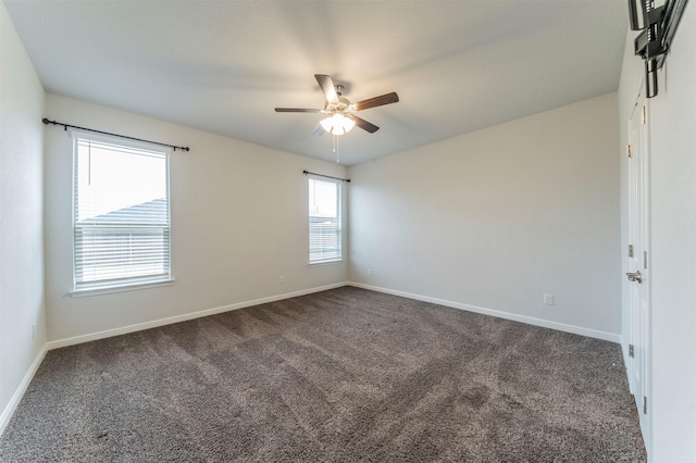 carpeted spare room with ceiling fan