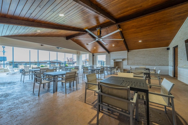 dining room featuring ceiling fan, beamed ceiling, wooden ceiling, and high vaulted ceiling