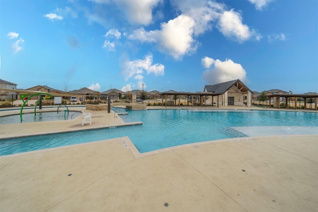 view of swimming pool featuring a patio