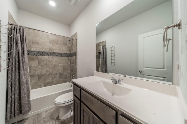 full bathroom with vanity, toilet, and shower / bath combo with shower curtain