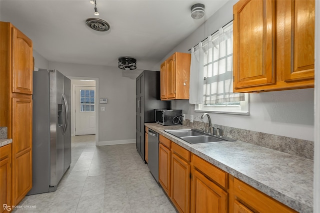 kitchen featuring sink and appliances with stainless steel finishes