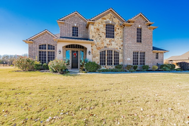 view of property featuring a front yard