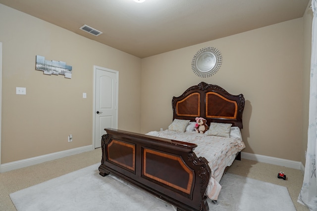 bedroom with light carpet