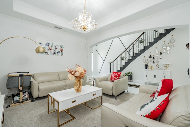 carpeted living room with a raised ceiling, an inviting chandelier, and ornamental molding