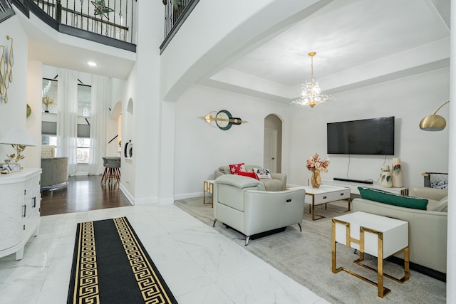 living room with hardwood / wood-style flooring and an inviting chandelier