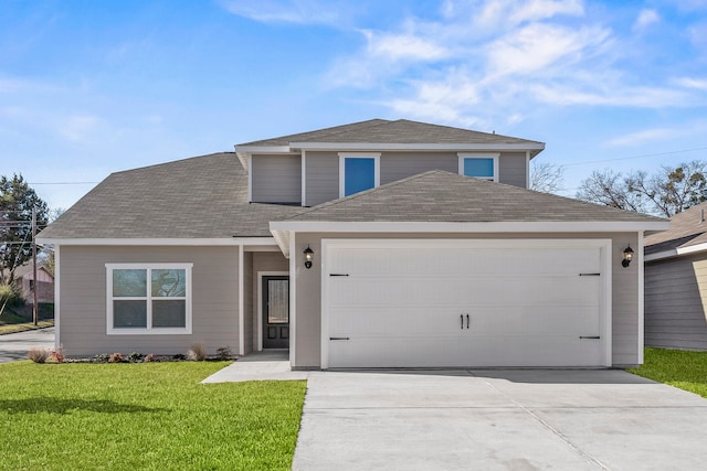 view of front property with a garage and a front yard