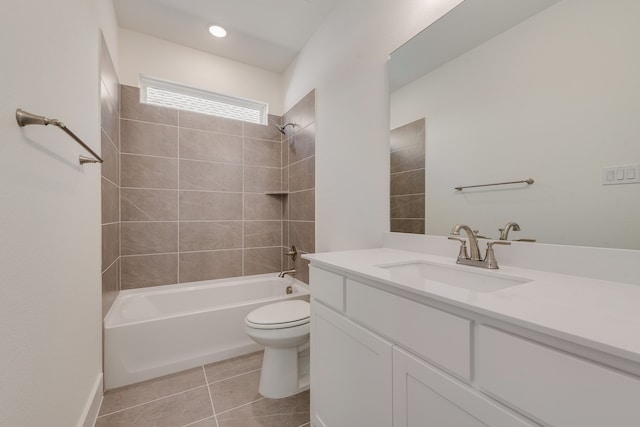 full bathroom featuring tile patterned flooring, vanity, toilet, and tiled shower / bath