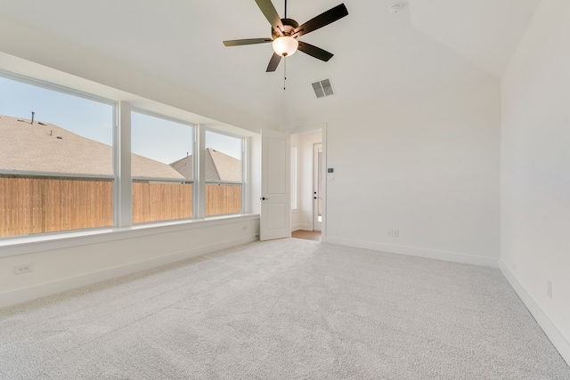 unfurnished room with light carpet, high vaulted ceiling, and ceiling fan