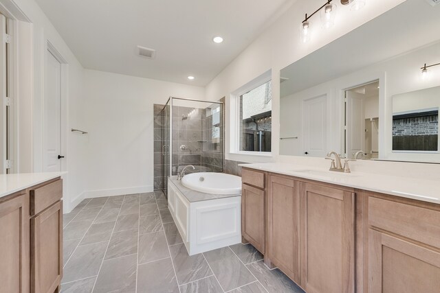 bathroom with vanity and plus walk in shower