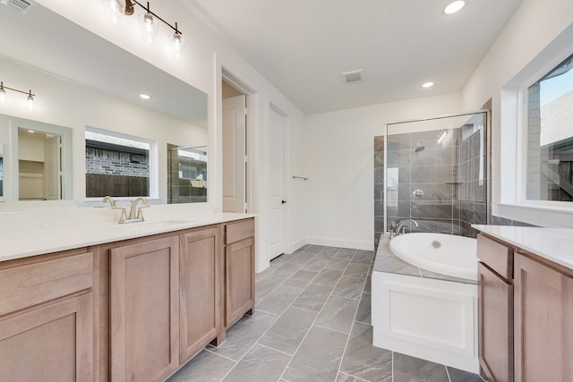 bathroom featuring vanity and plus walk in shower