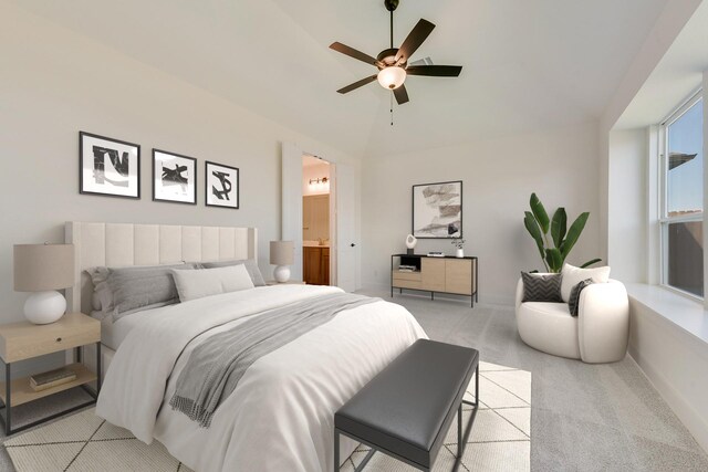 carpeted bedroom featuring ensuite bath and ceiling fan