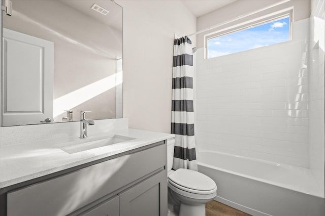 full bathroom with shower / bath combo with shower curtain, vanity, toilet, and wood-type flooring