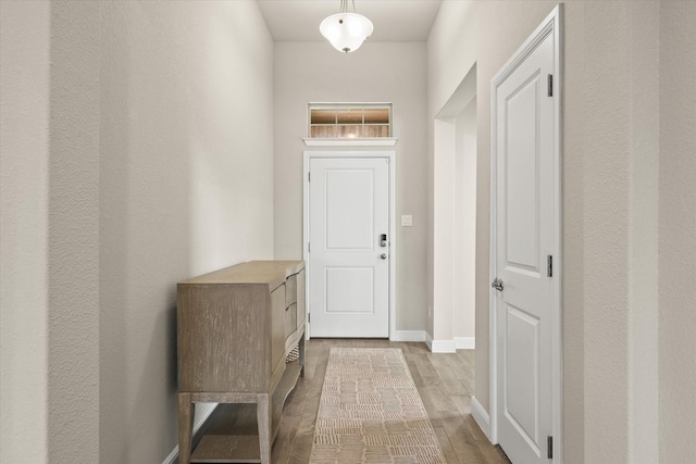 doorway with light hardwood / wood-style floors